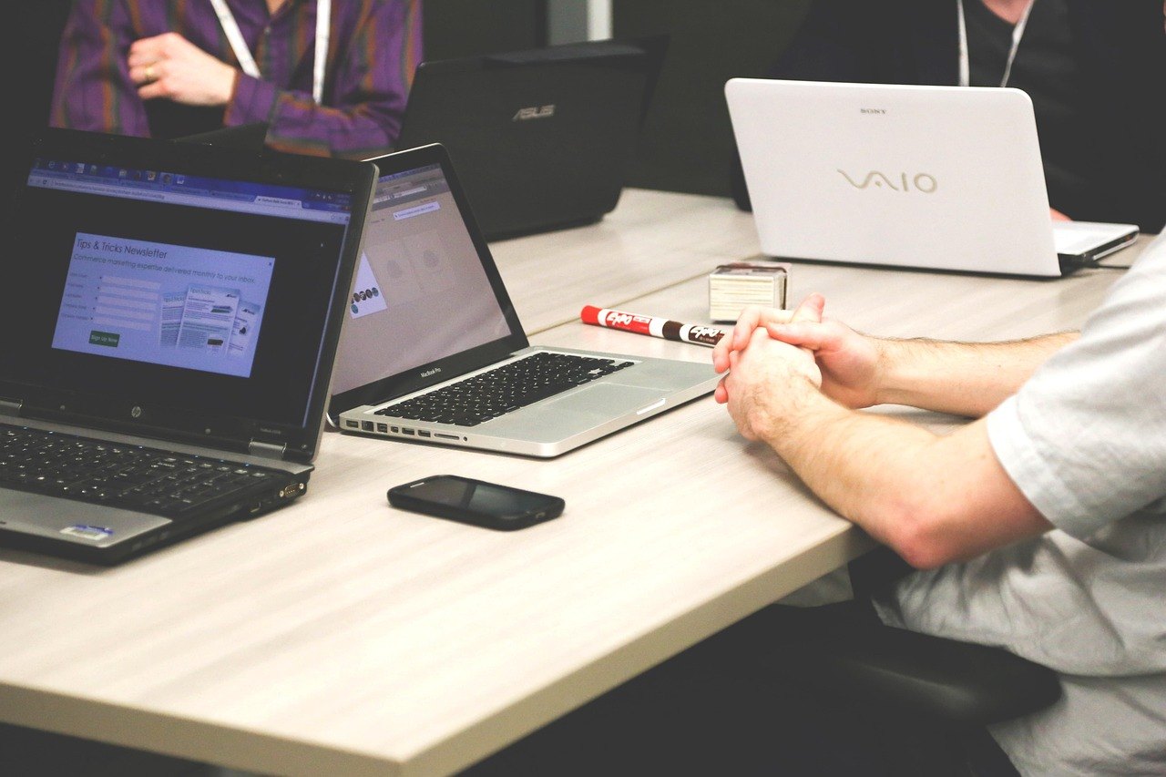 A working session: laptops open on a marketing dashboard